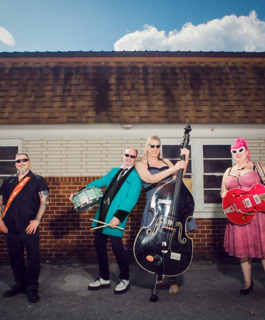 Jane Rose & The Deadends outside facing camera